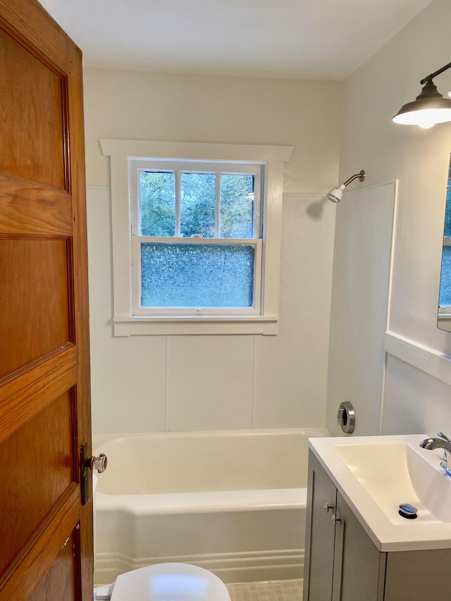 bathroom with vanity and  shower combination