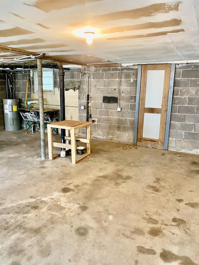 basement featuring electric water heater