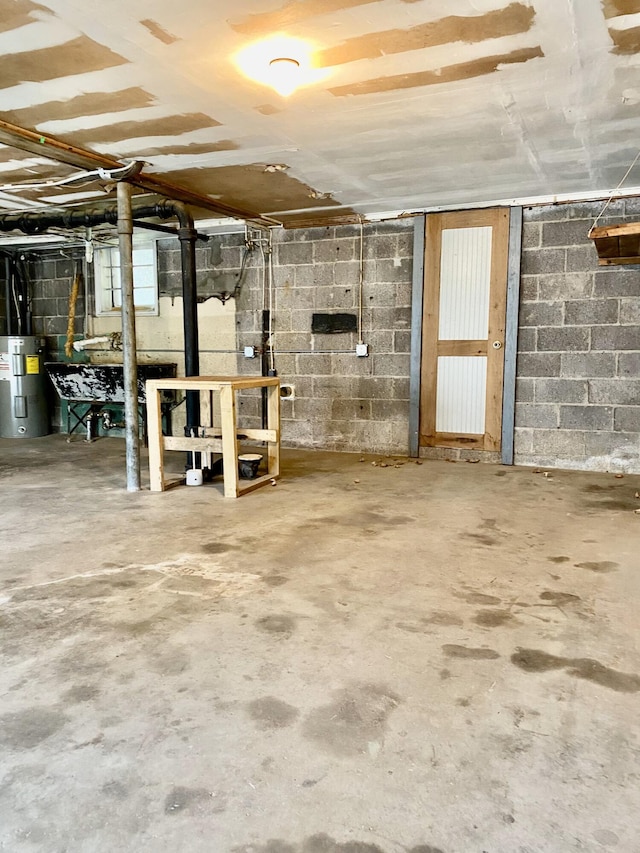 basement featuring electric water heater