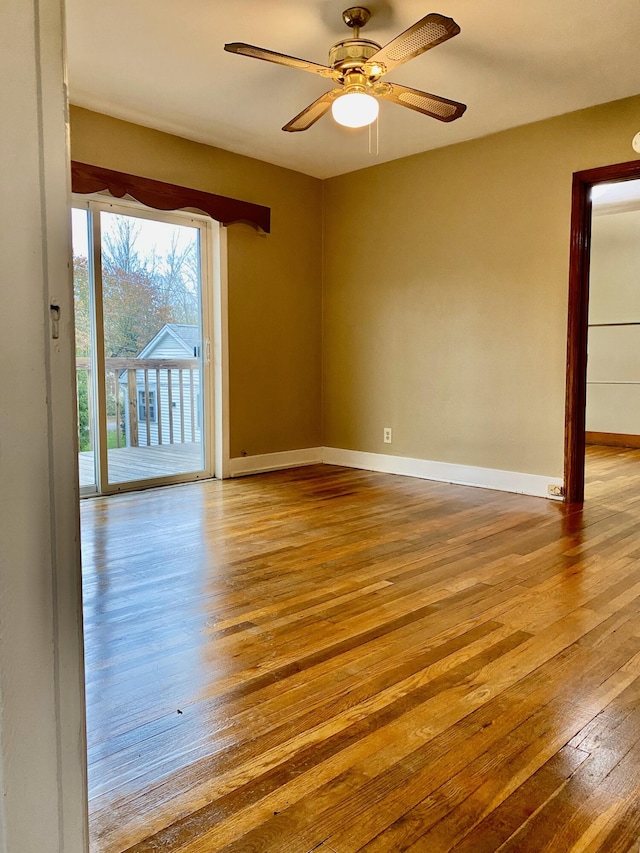 unfurnished room featuring light wood-type flooring and ceiling fan