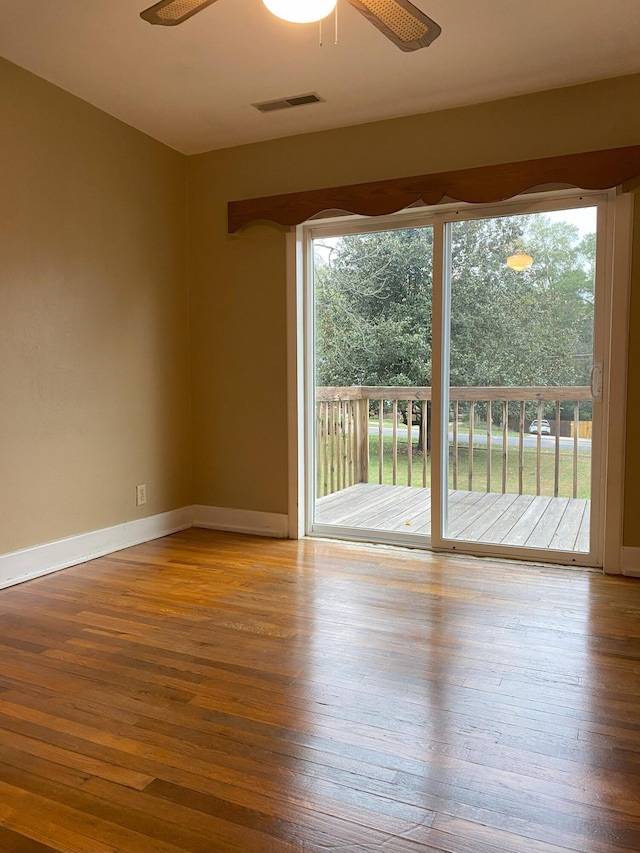 empty room with ceiling fan and light wood-type flooring