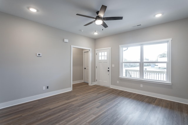 foyer with ceiling fan and dark wood-type flooring