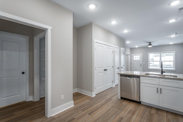 kitchen with stainless steel dishwasher, ceiling fan, sink, dark hardwood / wood-style floors, and white cabinetry