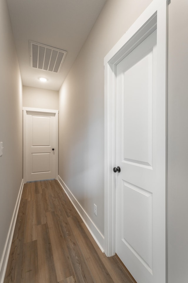 hallway featuring dark hardwood / wood-style floors