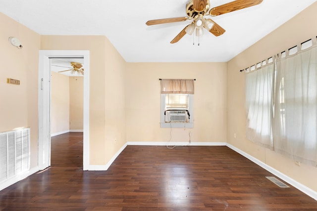 spare room featuring ceiling fan, dark hardwood / wood-style flooring, and cooling unit