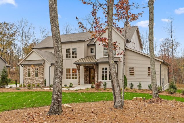 view of front of property with a front lawn