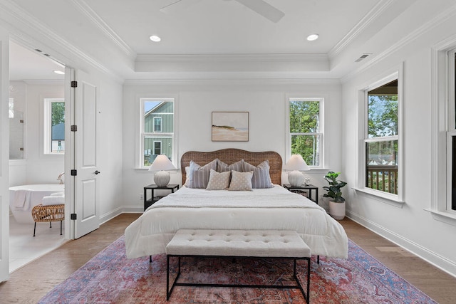 bedroom featuring hardwood / wood-style floors, ceiling fan, and ornamental molding