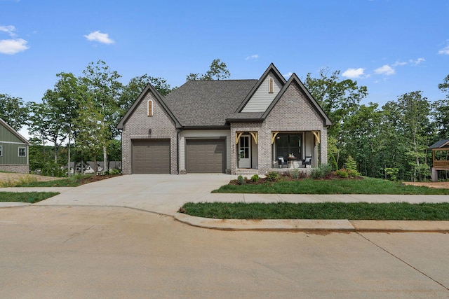 craftsman-style house featuring a porch and a garage