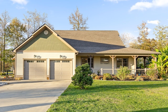 view of front of house with a front yard, a porch, and a garage