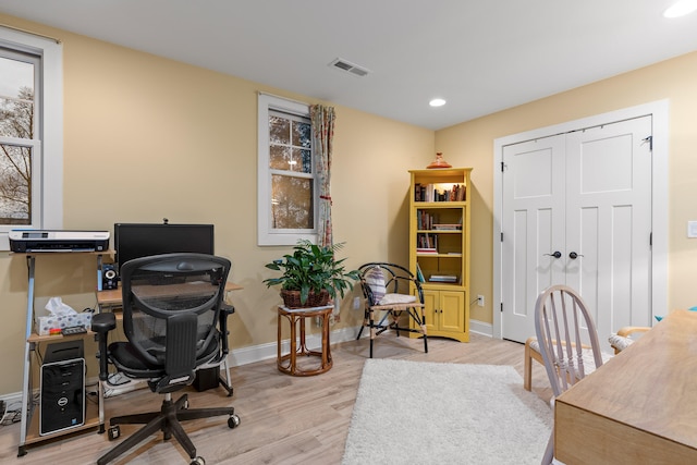 office space with light hardwood / wood-style floors