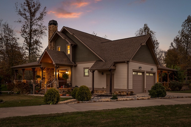 view of front facade with a yard and a garage