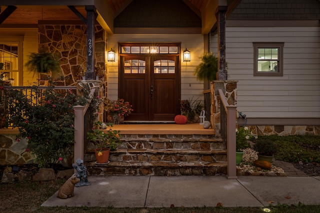 doorway to property featuring a porch