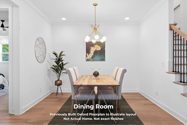 dining space featuring crown molding, hardwood / wood-style floors, and an inviting chandelier