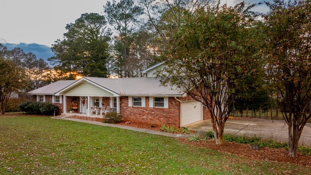 view of front of home featuring a lawn and a porch