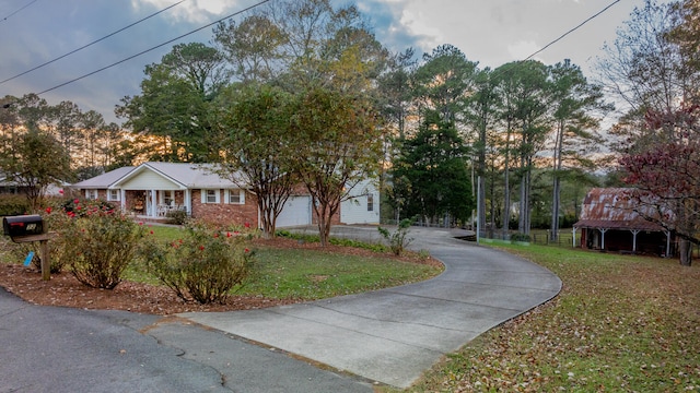 view of front of house with a front yard and a garage