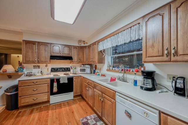 kitchen featuring white appliances, light hardwood / wood-style flooring, crown molding, and sink