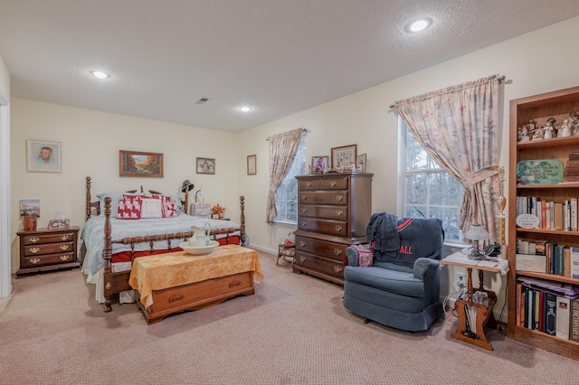 carpeted bedroom featuring a textured ceiling