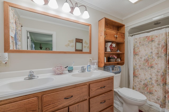 bathroom with vanity, toilet, ornamental molding, and a textured ceiling