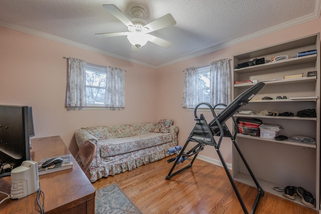 interior space featuring a textured ceiling, hardwood / wood-style flooring, plenty of natural light, and ceiling fan