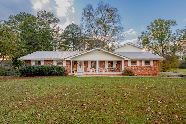 view of front of property with a front yard and a porch