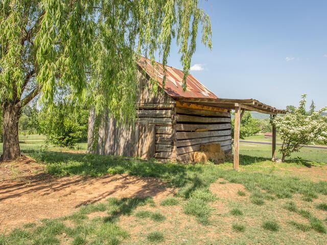 view of outdoor structure with a lawn