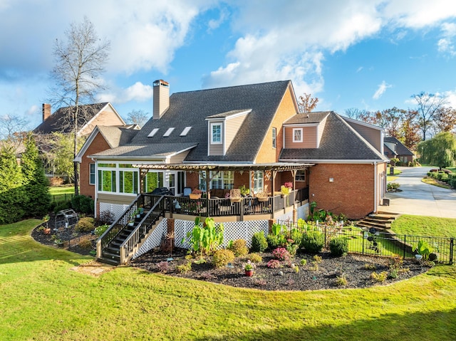 rear view of house featuring a yard