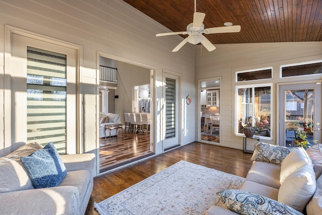 sunroom / solarium featuring ceiling fan, wood ceiling, and lofted ceiling