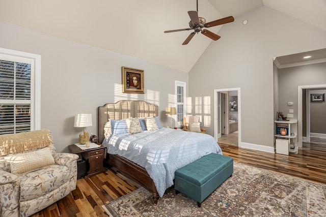 bedroom with ensuite bathroom, high vaulted ceiling, ceiling fan, and dark wood-type flooring