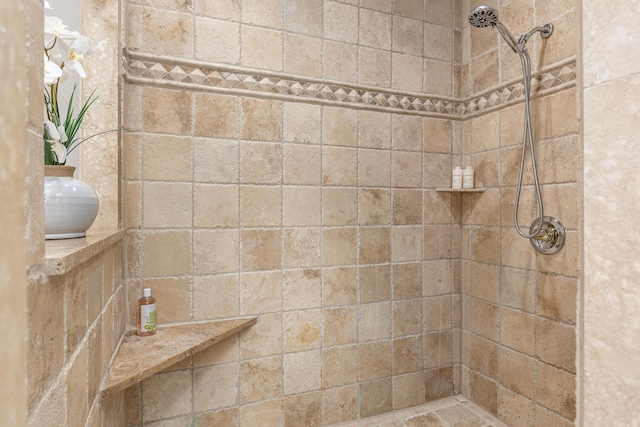 bathroom featuring tiled shower