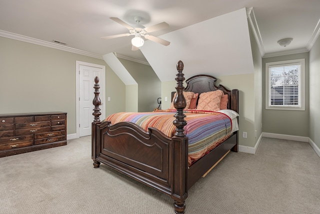 carpeted bedroom featuring ceiling fan, crown molding, and vaulted ceiling