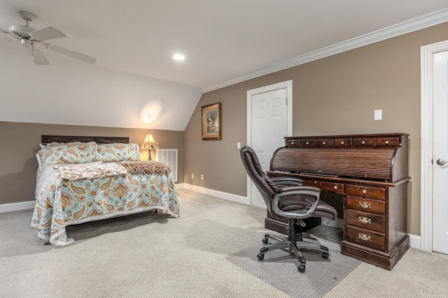 carpeted bedroom featuring vaulted ceiling, ceiling fan, and crown molding