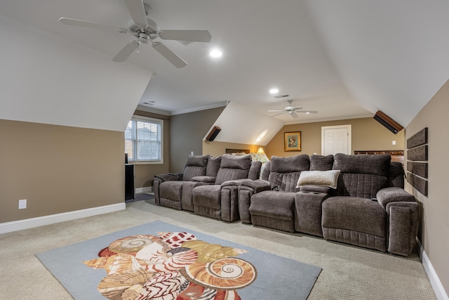 cinema room featuring crown molding, ceiling fan, and light carpet