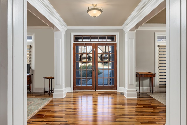 entryway with french doors, hardwood / wood-style flooring, and ornate columns