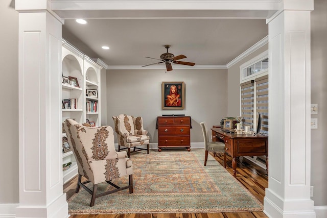 office featuring hardwood / wood-style flooring, ceiling fan, ornate columns, and ornamental molding