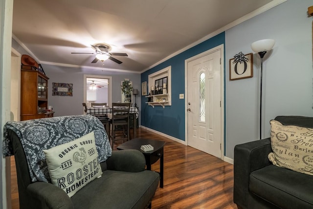 living room with dark hardwood / wood-style floors, ceiling fan, and crown molding