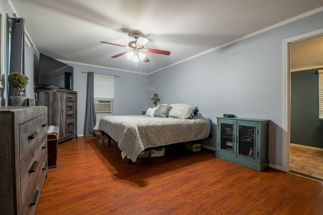 bedroom featuring hardwood / wood-style flooring, ceiling fan, cooling unit, and ornamental molding