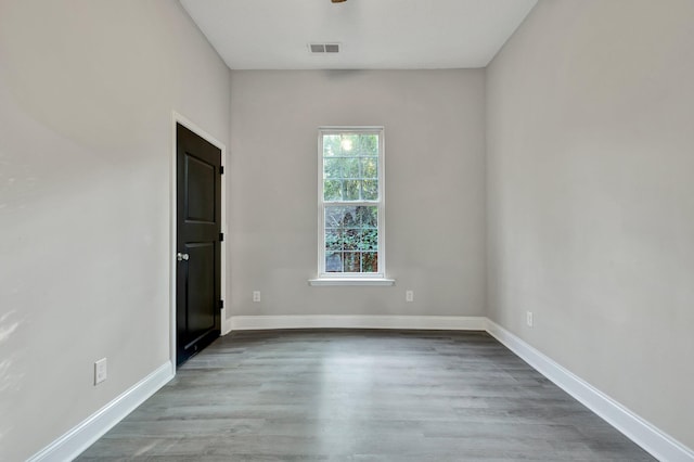 spare room featuring hardwood / wood-style flooring