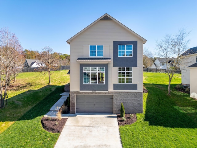 view of property with a front yard and a garage