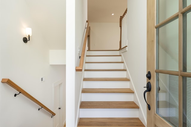 staircase featuring hardwood / wood-style floors