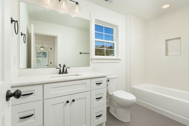 full bathroom with tile patterned flooring, vanity, toilet, and a wealth of natural light