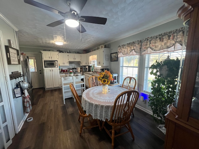 dining area featuring ornamental molding, a textured ceiling, ceiling fan, dark wood-type flooring, and sink