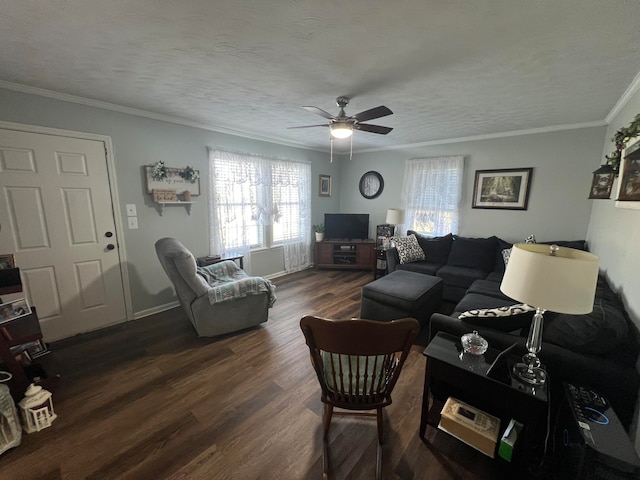 living room with a textured ceiling, dark hardwood / wood-style floors, ceiling fan, and crown molding