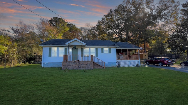 view of front of home with a lawn