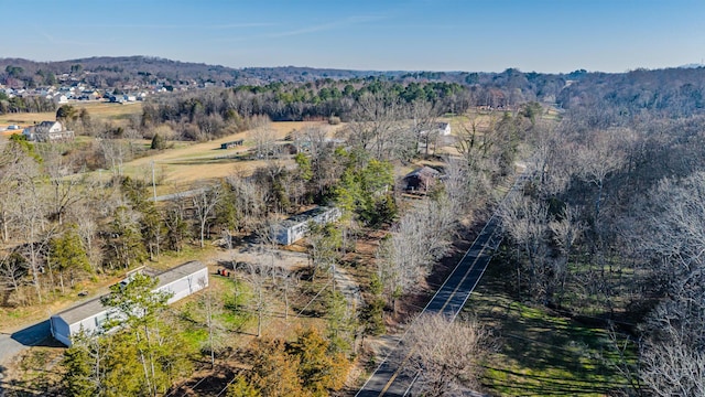 drone / aerial view featuring a view of trees