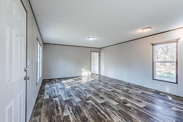 interior space featuring a decorative wall and wood finished floors