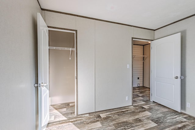 1418 County Road 700, Athens, TN 37303 - unfurnished bedroom featuring crown molding, wood finished floors, and a closet