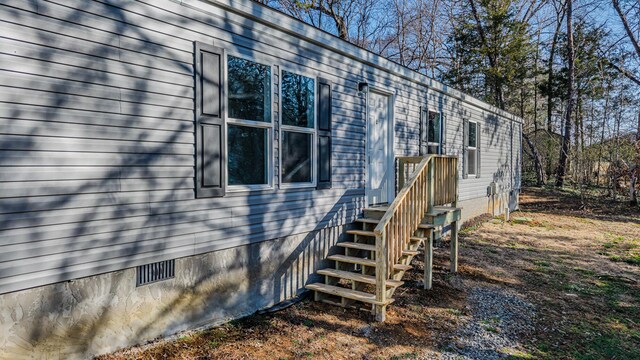 view of side of home with crawl space