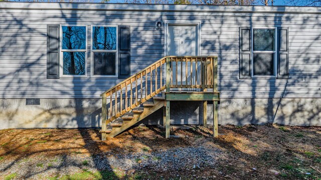 view of exterior entry with crawl space