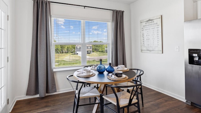 dining area featuring dark hardwood / wood-style floors