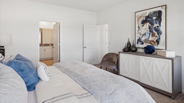 carpeted bedroom with ensuite bath